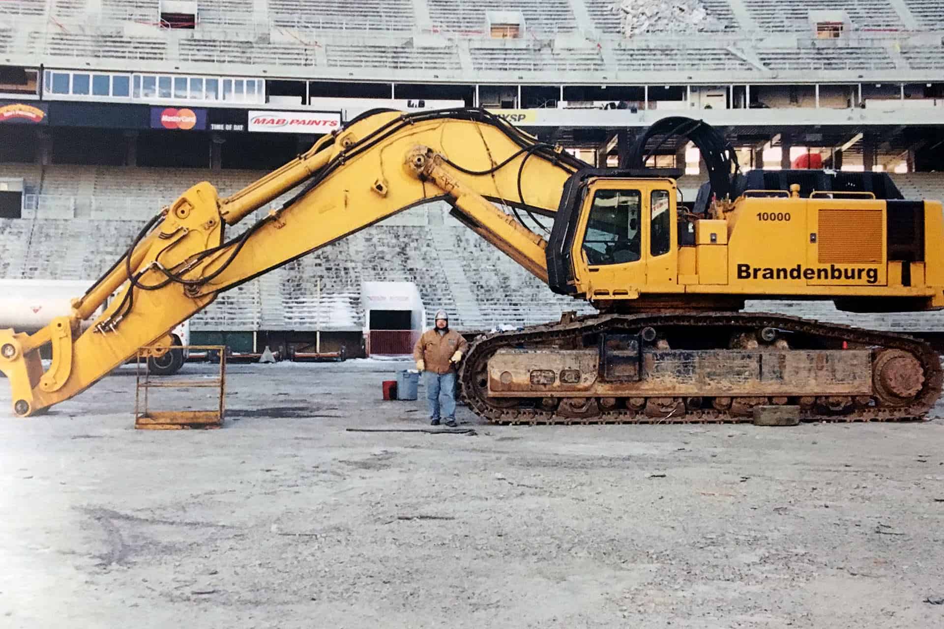 Nick Peetros with a crane during demolition inside the stadium.